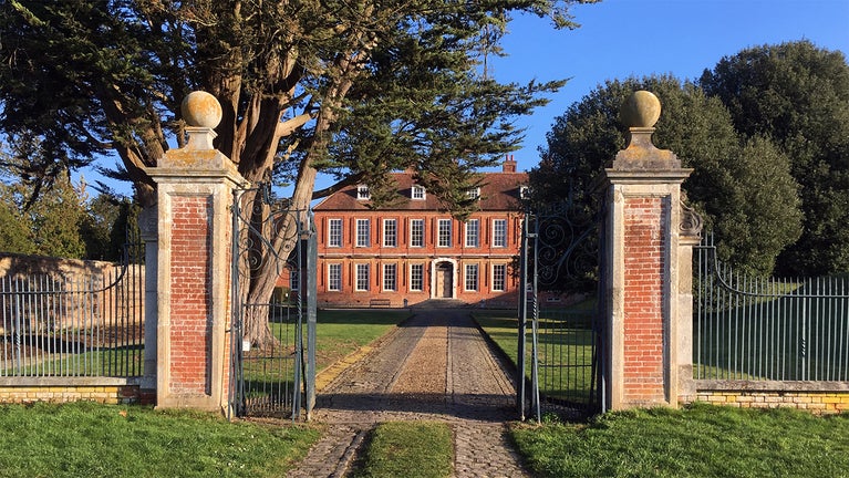 View through the gates towards Bradenham Manor in the Chilterns Countryside, Buckinghamshire.
